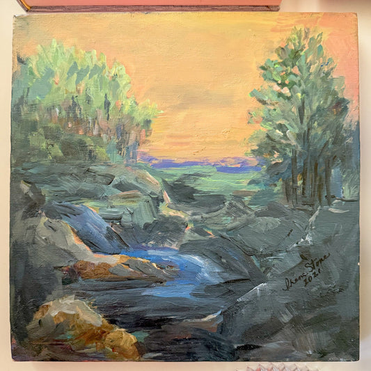 Painting of a landscape with trees and a river on a wall.